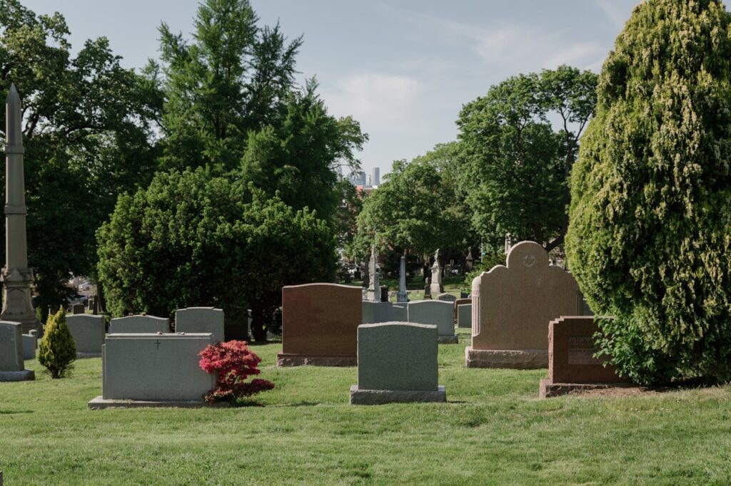 Calm cemetery scene with tombstones and lush greenery. Ideal for memorial themes.